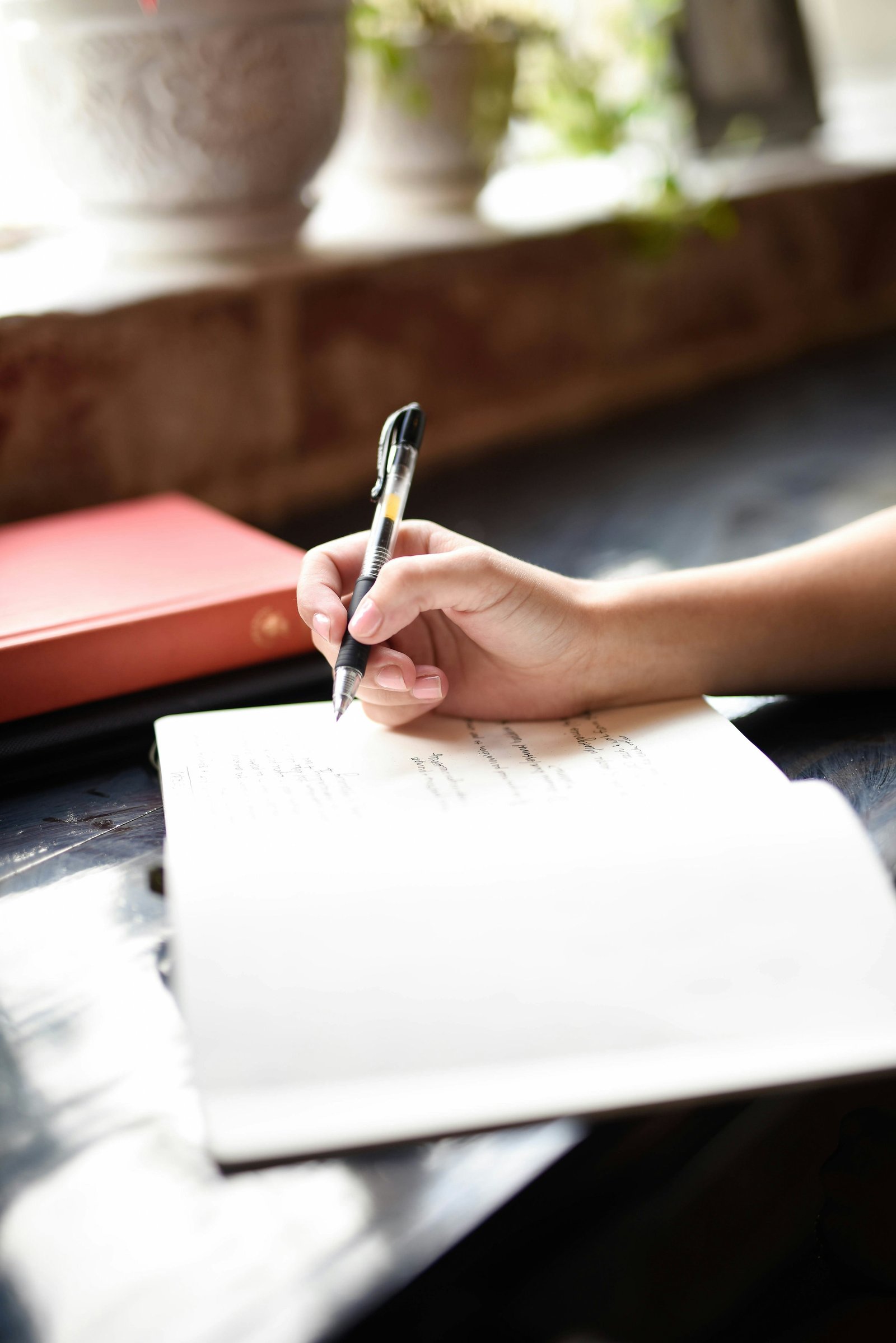 Person writing in a notebook